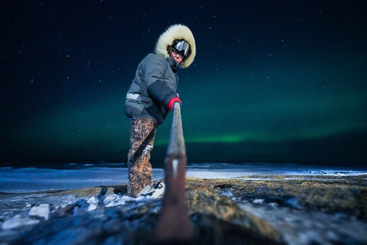 AkeyaRyan-Subsistence-manwithpole AkeyaRyan-Subsistence-manwithpole